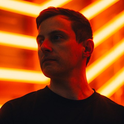 Sky Thomas Gidge, lit by orange neon